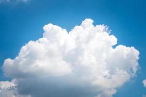 Large singleCumulonimbus clouds. cumulus cloud. Puffy or cotton like or fluffy cloud blue sky white fluffy clouds over blue sky landscape. photo