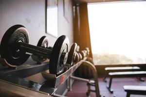 Dumbbell on barbell in club center fitness workout. photo