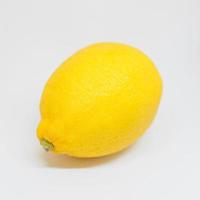 stylish yellow lemon on white background. Citrus, summer, fruits concept photo