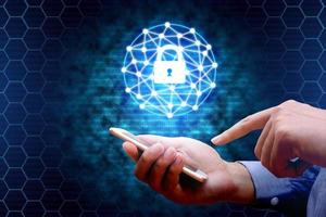 Cyber security concept. businessman using smartphone with lock network icon. photo