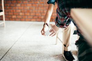 Two school hand passing notes to each other secretly during class. photo