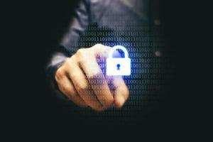 Businessman pressing lock icon with binary, cyber security concept. photo