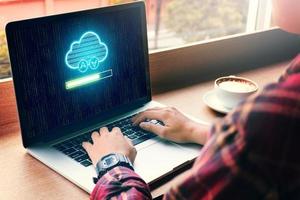 Hipster man hand using laptop with cloud computing and uploading files on cloud network server. photo