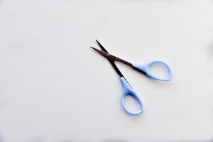 Iron nail scissors on a white background photo