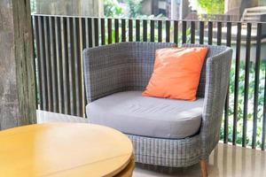outdoor patio chair with pillow on balcony photo