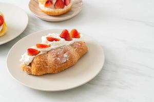 strawberry fresh cream croissant on plate photo