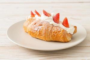 strawberry fresh cream croissant on plate photo