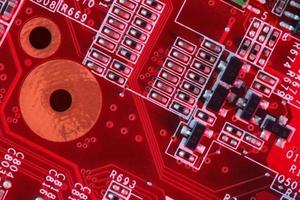 Electronic Printed Circuit Board in red with Electronic components photo