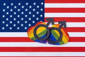 The flag of America and the heart in the form of the LGBT flag. photo