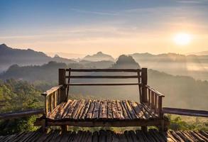 Viewpoint wood terrace with sunshine mountain at morning photo