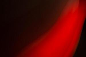 Abstract red light on a black background. photo