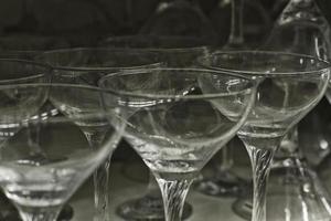 Empty glass set. Isolated on dark background.Transparent goblets textured. photo