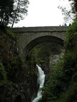 Stone bridge over a river photo