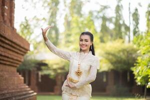 Beautiful Woman wearing typical Thai dress photo