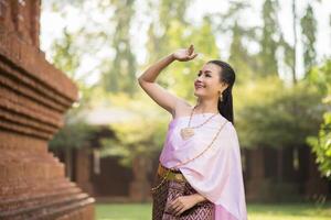 Beautiful Woman wearing typical Thai dress photo