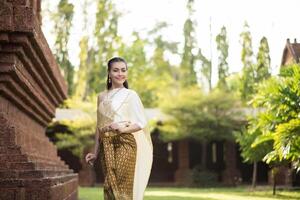 Beautiful Woman wearing typical Thai dress photo