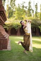 Beautiful Woman wearing typical Thai dress photo