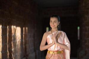 Beautiful Woman wearing typical Thai dress photo