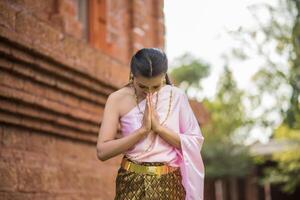 Beautiful Woman wearing typical Thai dress photo