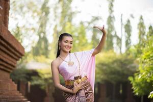 Beautiful Woman wearing typical Thai dress photo