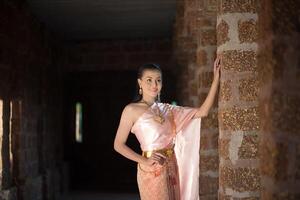 Beautiful Woman wearing typical Thai dress photo