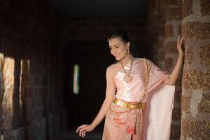 Beautiful Woman wearing typical Thai dress photo