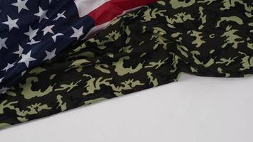 American flag and Military camouflage pattern. Top view angle. photo