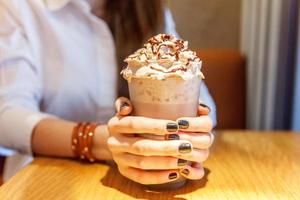 Latte macchiato in tall glass close up photo