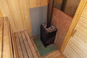 Interior details of traditional Finnish sauna steam room. Traditional old Russian bathhouse SPA Concept. Relax country village bath concept. photo