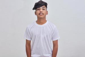 Handsome Indian young boy wearing white t-shirt. photo