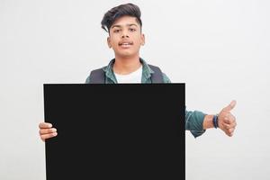 Indian college student showing board on white background. photo