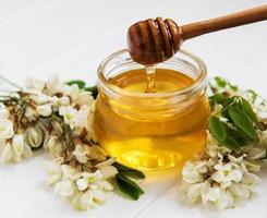 Honey with acacia blossoms photo