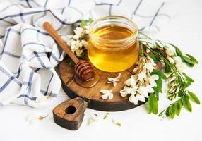 Honey with acacia blossoms photo