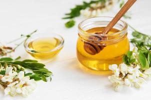 Honey with acacia blossoms photo