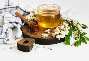 Honey with acacia blossoms photo