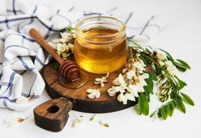 Honey with acacia blossoms photo
