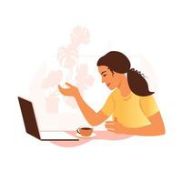 una mujer trabaja y se comunica en una computadora portátil, sentada en una mesa en casa con una taza de café y papeles. ilustración vectorial plano. vector