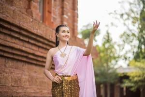 Beautiful Woman wearing typical Thai dress photo