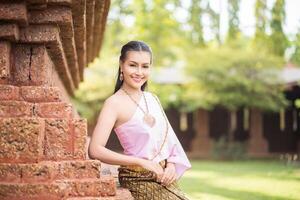 Beautiful Woman wearing typical Thai dress photo