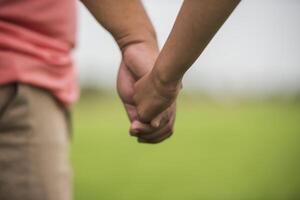 Father and daughter holding hand in hand together photo