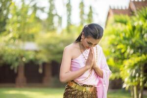 Beautiful Woman wearing typical Thai dress photo