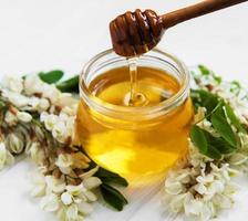 Honey with acacia blossoms photo