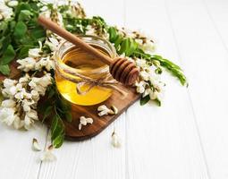 Honey with acacia blossoms photo