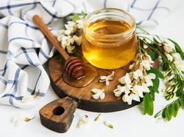 Honey with acacia blossoms photo