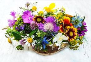 Wild flowers on a table photo