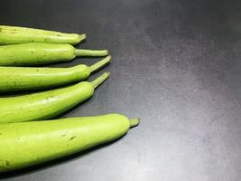 bottle gourd, Lagenaria siceraria isolated on black background. photo