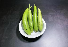 bottle gourd, Lagenaria siceraria isolated on black background. photo