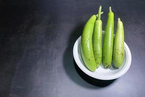 bottle gourd, Lagenaria siceraria isolated on black background. photo