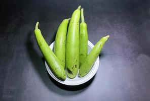 bottle gourd, Lagenaria siceraria isolated on black background. photo