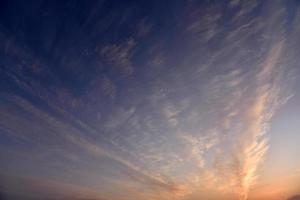 Beautiful rose blue evening sunset with clouds photo